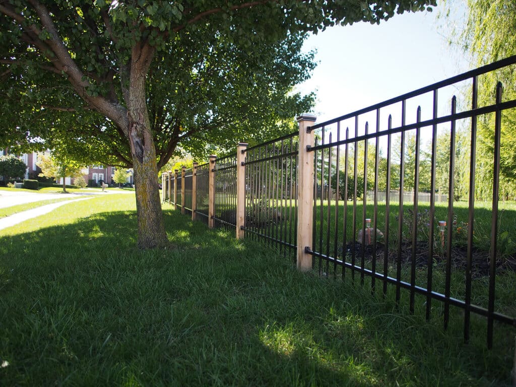 Custom aluminum fence installation with cedar posts in Indianapolis