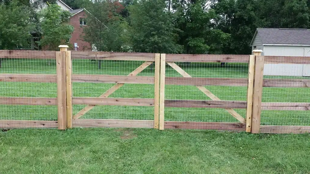 Indianapolis custom rail fence installation with chicken wire
