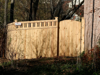 Custom wood lattice-topped fence installation around Indianapolis
