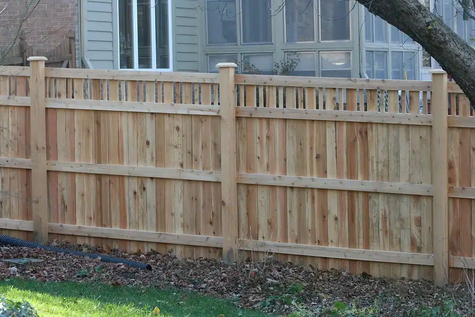 Wooden lattice-topped fence installation around Indianapolis