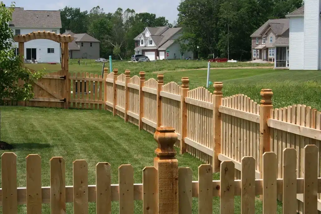 Custom wooden picket fence installation around Indianapolis