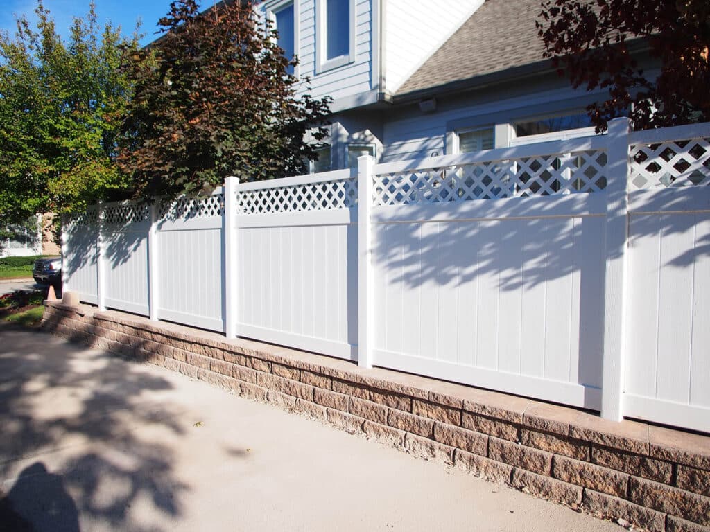 Install a vinyl fence with lattice-top around Indianapolis