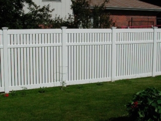 Vinyl lattice top fence installation around Indianapolis